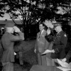 <p>A soldier salutes Colonel Bernard Lentz (center right), Fort Slocum's commanding officer, 1945. The occasion is a graduation exercise for the honor battalion of the Second Service Command&#39;s Rehabilitation Center, which operated at Fort Slocum from late 1944 until mid-1946. The civilian to the left of Col. Lentz is Stanley Church, New Rochelle&#39;s mayor. Capt. Eunity Frances Elderdice stands to Col. Lentz&#39;s right.</p>